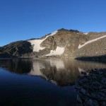 Die Ausläufer des Ankogels spiegeln sich kräftig im See